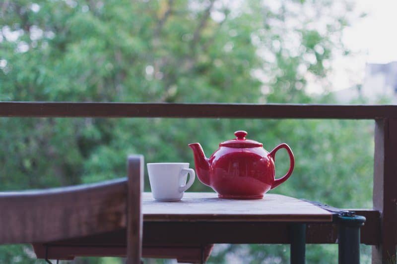 A Teapot And Mug On A Table 